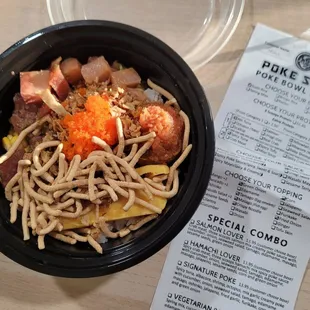 poke bowl (sushi rice, ahi tuna, yellowtail, spicy tuna, green onion, tamago, masago, crispy noodle, corn, fried onion)