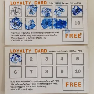 two loyalty cards on a table