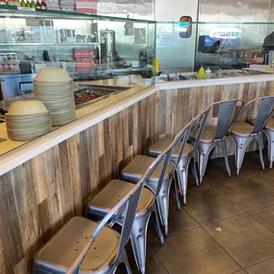 a row of chairs in a restaurant