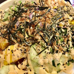a bowl of food with a variety of toppings