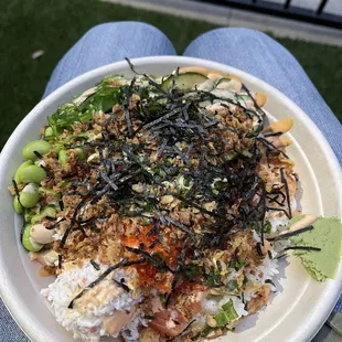 a person holding a plate of food