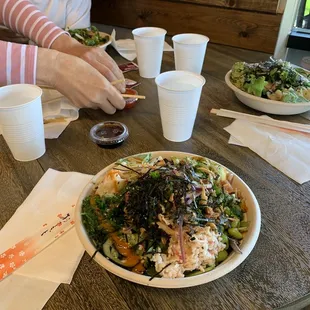 a woman eating a salad at a restaurant