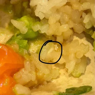 That is a clump of rice where you can see it is not fully cooked. And when I broke a grain apart in my fingers it was powdery.