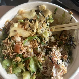 Supposedly: rice, salmon, spicy salmon, cucumber, green onion, ginger, crunchy onion, dry seaweed, masago, crab meat, seaweed salad.