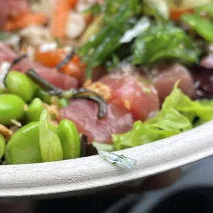 a person holding a plate of food
