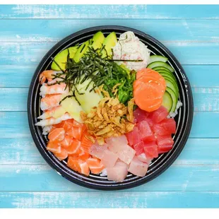 a plate of sushi and vegetables