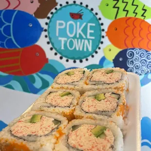 a plate of sushi rolls