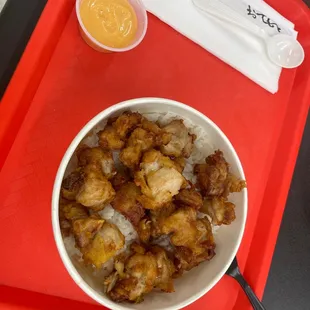 a bowl of food on a red tray