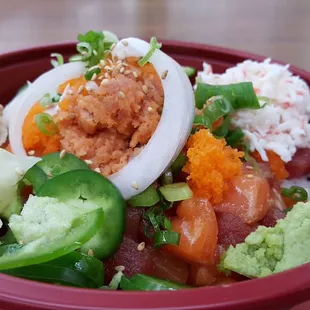 Amazing Poke bowl with salmon, tuna, spicy tuna, and crab.