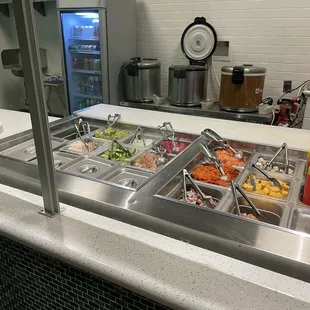 a buffet with a variety of food items