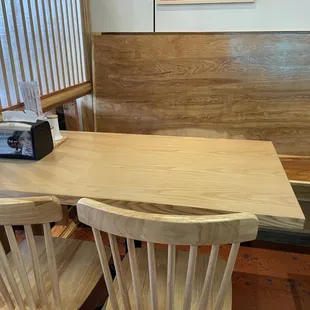 Seating With a Long Bench and Wooden Chairs