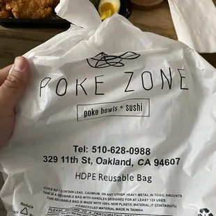 a person holding a bag of food