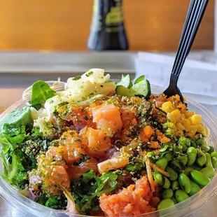 a salad in a bowl with a fork
