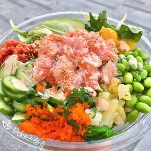 a poke poke bowl with a variety of vegetables