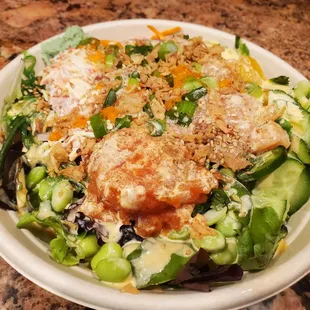 a bowl of salad on a table