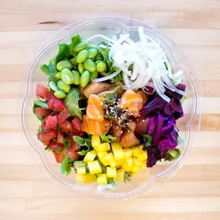 a bowl of food on a wooden table