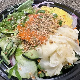 a bowl of food with a variety of toppings