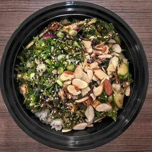 Chicken, red onions, jalapeños, green onions, kale, almonds, white &amp; black sesame seeds, cucumbers, classic sauce, &amp; teriyaki sauce.