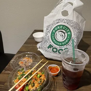 a bowl of sushi and chopsticks on a table