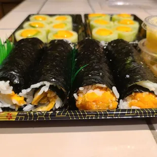 2 spicy salmon handrolls. 2 spicy scallop handrolls.