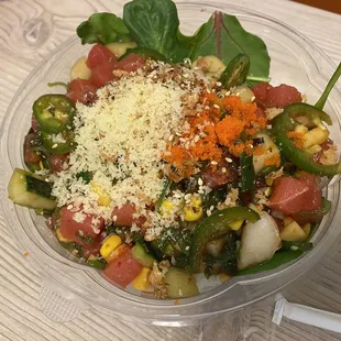 Tuna, cucumber, lettuce, rice, jalapeño, corn, mango, crunch, sriracha, and their traditional sauce...a few other things