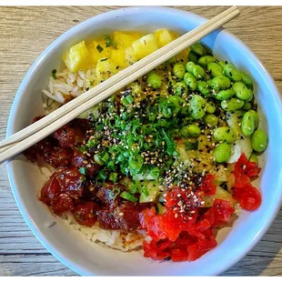 Shoyu tuna poke bowl with pickled radish, edamame, and pineapple