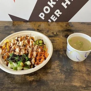 Rice Bowl with 2 scoops of protein (chicken and tofu), Seaweed Salad, corn, cucumber, carrots, mango, pineapple, and sweet onion (6.25.22)