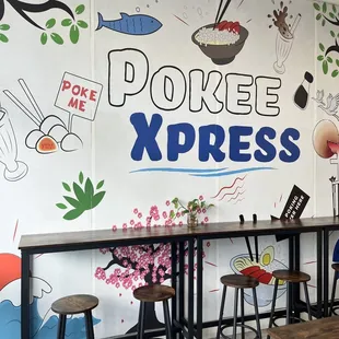 a restaurant with a mural on the wall