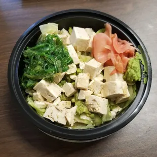 Regular bowl: brown rice, lettuce, avocado, cucumber, double tofu, seaweed salad, ginger, wasabi, ponzu sauce.