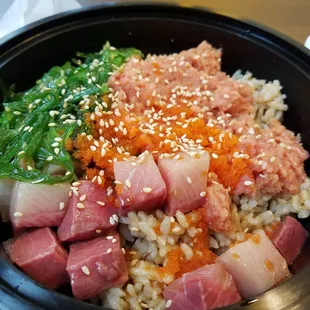 So fresh!  Yellowtail and spicy tuna w seaweed, avocado over brown ricenw ponzu sauce.