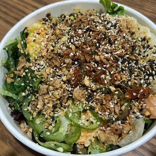 Salmon Poke bowl with half salad and half brown rice