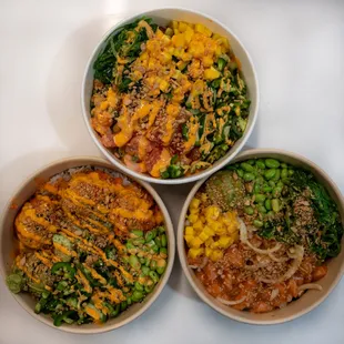 three bowls of food on a table