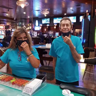 Kimmy &amp; Charlie - two of the friendliest blackjack dealers in town, wearing short sleeves so they won't be accused of hiding cards.