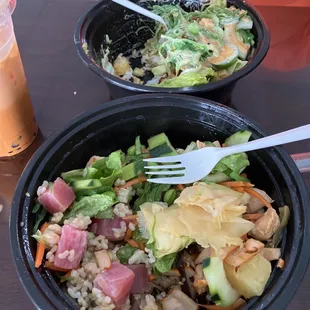 Brown Rice Bowl with Teriyaki Chicken, salmon, squid salad, lettuce, cucumber, pineapple, corn, edamame, ginger and sushi sauce.
