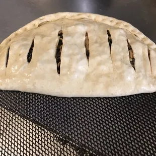 a piece of pie on a grill