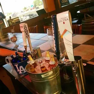 a bucket full of bottles of beer