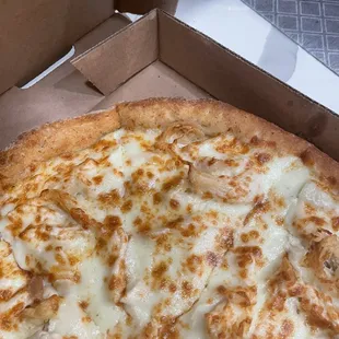 a half eaten pizza in a box