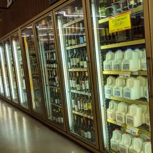 Milk and some wine in refrigerator