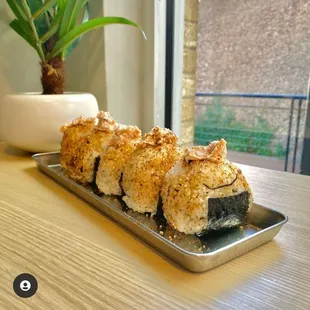 a plate of sushi on a table