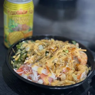a bowl of food and a can of beer