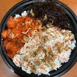Korean Temper Salmon on sushi rice with masago, crab salad and ogo topped with crispy onions. Oishiiii!