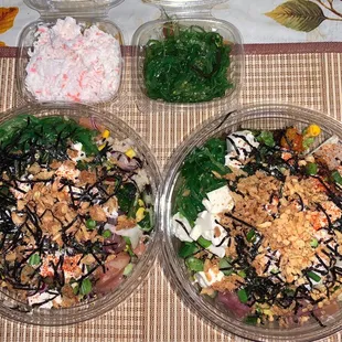 Poke bowls, seaweed salad, surimi salad