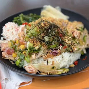 Salmon and tuna (torched) poke bowl, medium umami shoyu, almost all the toppings including Thai chilies and shredded nori.