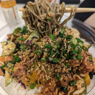 a plate of food with noodles and vegetables