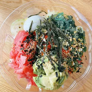 a bowl of food on a wooden table
