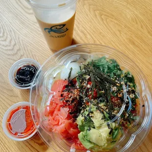 a bowl of food and a drink on a table