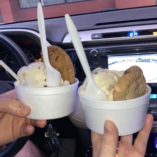 Cookie cup both with cookie dough ice cream one with a Tuxedo cookie and the other with a State Fair cookie.