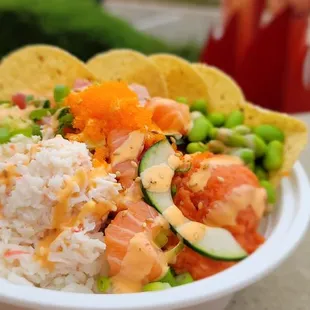 a bowl of food with rice and vegetables