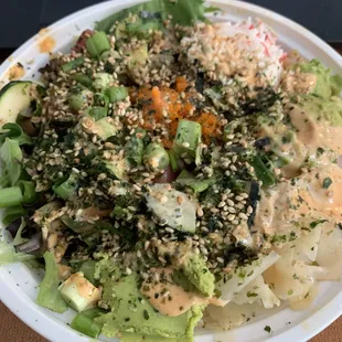 This is a large, less brown rice, more mixed greens, 4 proteins, medium spicy sauce, and spicy poke sauce