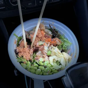 A bit of everything over mixed greens